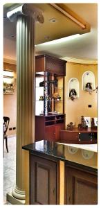 a kitchen with a column in the middle of a room at Dream of Chantal in Casal Palocco