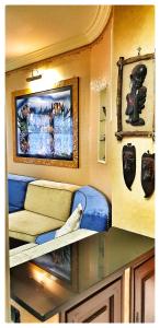 a room with a couch and a picture on the wall at Dream of Chantal in Casal Palocco