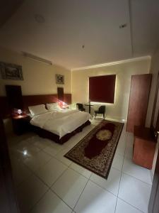 En eller flere senger på et rom på Nice Suites & Hotels