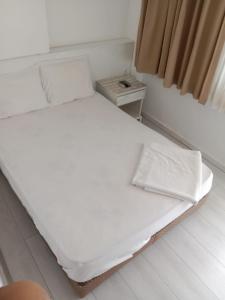 Postel nebo postele na pokoji v ubytování Margo Apart