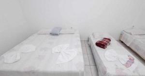 Giường trong phòng chung tại Pousada Caldas Novas