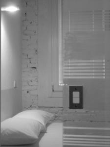 Postel nebo postele na pokoji v ubytování Legrenzi Rooms