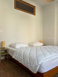 Кровать или кровати в номере BRINC-JOLI DUPLEX