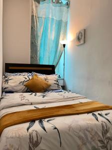 Postel nebo postele na pokoji v ubytování Tanih Place