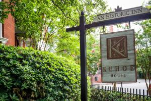 a street sign in front of a building with a house at Kehoe House, Historic Inns of Savannah Collection in Savannah