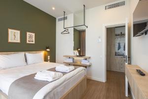 Postel nebo postele na pokoji v ubytování Apart Hotel Kundzuli