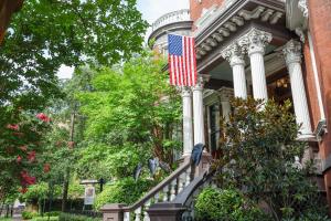 an american flag on the side of a house at Kehoe House, Historic Inns of Savannah Collection in Savannah