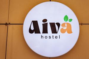 a sign for anova hospital hanging on a wall at Aiva Hostel in Bishkek