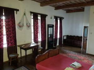a living room with a couch and a table at Садиба Сцибор-Мархоцького in Otrokov