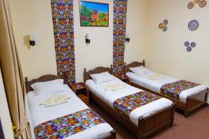 Ένα ή περισσότερα κρεβάτια σε δωμάτιο στο Shakh Sultan