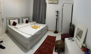 Letto o letti in una camera di Ahmose Pyramids view inn