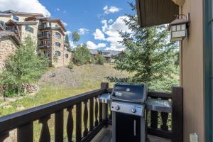 a grill on the balcony of a house at Belvedere 4 townhouse in Telluride
