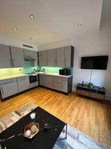 a large kitchen with a table in the middle of it at 1 BR in St James Piccadilly HY10 in London
