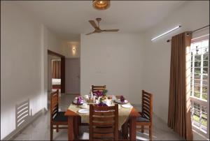 a dining room with a table and chairs at Shiv Dwelling - Full Villa in Ujjain