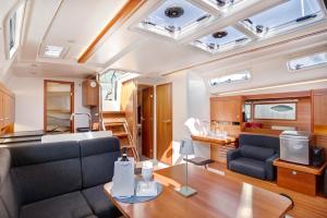 a living room with a couch and a table at Sailboat Hanse 455 in Positano