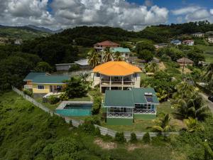 an aerial view of a house with a swimming pool at Waves Villa Guesthouse in Kingstown