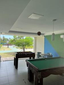 a billiard room with a pool table and a pool table at Flat Palm village in Porto De Galinhas