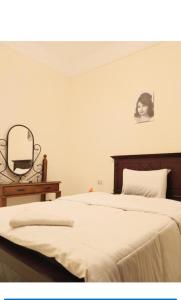 Letto o letti in una camera di Ahmose Pyramids view inn