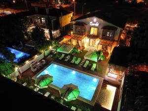 an overhead view of a swimming pool at night at Şerefe Hotel Alaçatı in Alaçatı