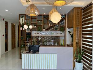 a lobby of a restaurant with a reception desk at Casa Bicolandia Suites in Daraga