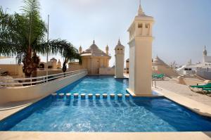 a swimming pool in the middle of a building at Puerto Marina Luxury Studio in Benalmádena