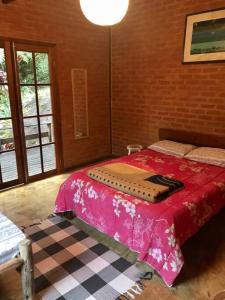 Ліжко або ліжка в номері Casa Cachoeira do Escorrega - Visconde de Mauá