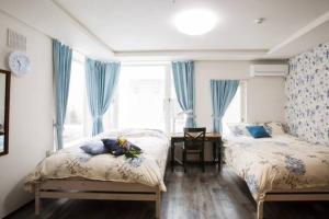Voodi või voodid majutusasutuse Snow House Hotel toas