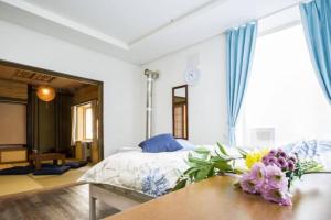 Voodi või voodid majutusasutuse Snow House Hotel toas