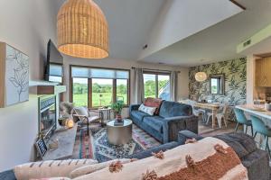 a living room with a couch and a table at The Golf View, boutique Galena getaway! in Galena