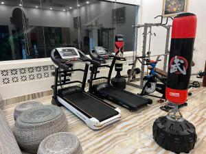 a gym with a cell phone and some exercise equipment at Bungalow Sáng Tươi Mountains in Phu Quoc