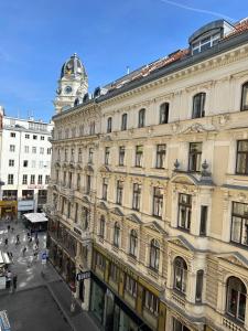 a large building with a clock tower on top of it at Stephansdom apartment in Vienna