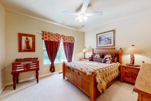 a bedroom with a bed with a teddy bear on it at Osprey Cabin in Pinetop-Lakeside