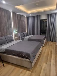 Katil atau katil-katil dalam bilik di Căn hộ TMS Pullman Nhớ