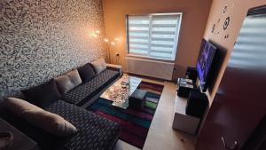 TV a/nebo společenská místnost v ubytování Apartman-Suite "Marinero"