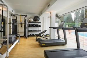 a gym with a treadmill and some exercise equipment at Hotel Scalinatella in Capri