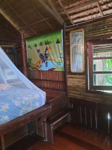 Postel nebo postele na pokoji v ubytování Sabai Corner Bungalows - SHA Extra Plus