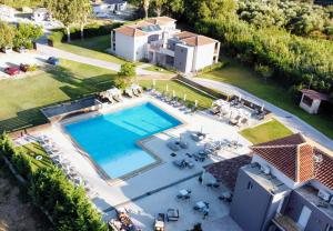 an aerial view of a house with a swimming pool at Aligis Studios in Katelios