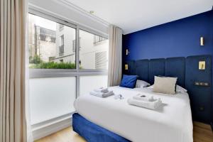 Łóżko lub łóżka w pokoju w obiekcie Incroyable appartement - 3BR-8P - Pl de la Nation