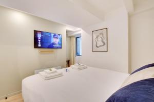 Łóżko lub łóżka w pokoju w obiekcie Incroyable appartement - 3BR-8P - Pl de la Nation
