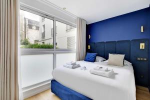 Łóżko lub łóżka w pokoju w obiekcie Incroyable appartement - 3BR-8P - Pl de la Nation