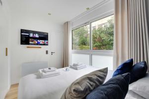 Łóżko lub łóżka w pokoju w obiekcie Incroyable appartement - 3BR-8P - Pl de la Nation