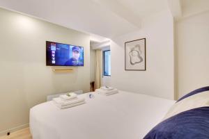 Łóżko lub łóżka w pokoju w obiekcie Incroyable appartement - 3BR-8P - Pl de la Nation