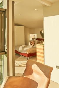 a bedroom with a bed and a mirror at Avington Estate in Winchester