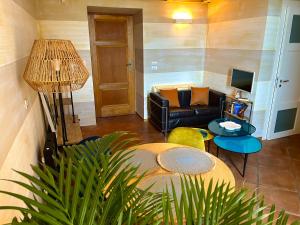 a living room with a couch and a table at Una finestra sul mare in Bari