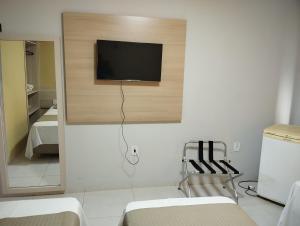 a room with a flat screen tv on a wall at Gurgueia Park Hotel in Cristino Castro