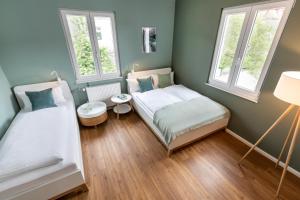 Postel nebo postele na pokoji v ubytování PRIMERA Zimmer mit Gemeinschaftsbad