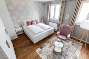 Postel nebo postele na pokoji v ubytování PRIMERA Zimmer mit Gemeinschaftsbad