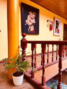 a staircase with a painting of a baby on the wall at Havana Nights Phi Phi in Phi Phi Don