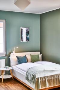 Postel nebo postele na pokoji v ubytování PRIMERA Zimmer mit Gemeinschaftsbad