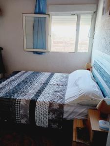 A bed or beds in a room at NIUMAR Acogedor apartamento muy luminoso con terraza